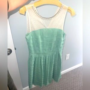 Mint green boutique dress with tags size small. Pearl neck lining. FABLE